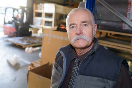 senior warehouse worker portraitの写真素材