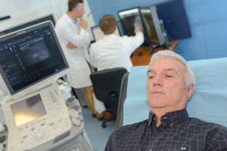 patient waiting in hospital bed for resultsの写真素材