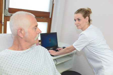nurse having a conversation with a confined patient