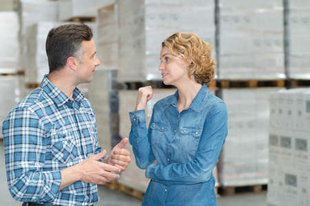 woman and man during warehouse invertory managementの写真素材