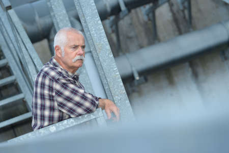 senior male industrial engineer in industrial plantの写真素材