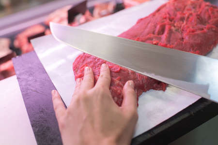 cutting a red meatの写真素材