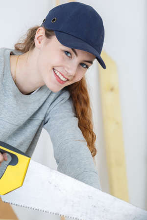 portrait of beautiful young female carpenterの写真素材