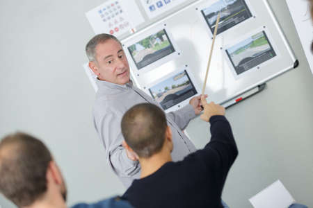 driving instructor teaching studentsの写真素材