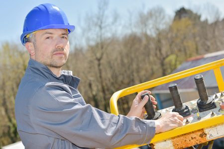 manual worker operating crane