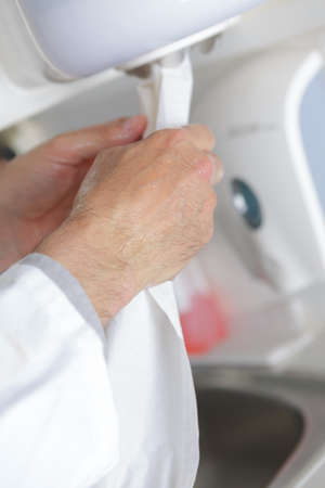 drying hands with towel after washingの写真素材