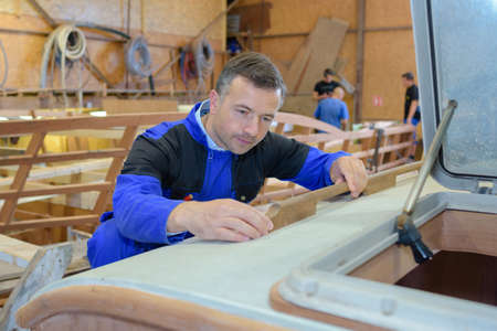 image of mature carpenter in the workshopの写真素材