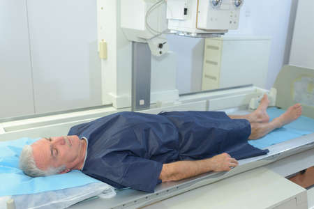 mature patient laying on a hospitalの写真素材