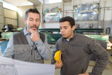 two worker in factoryの写真素材