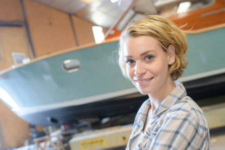 beautiful female marine builder in the shedの写真素材