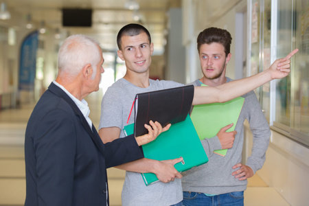 male teacher with two students