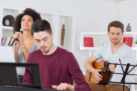 home band learning new song togetherの写真素材