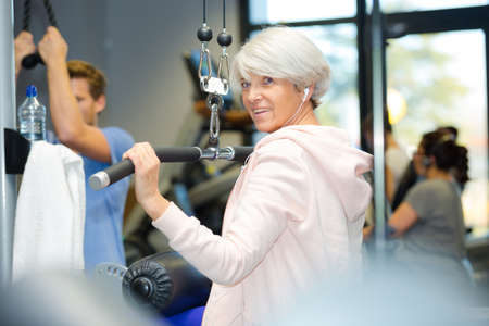 senior woman working out in gymの写真素材