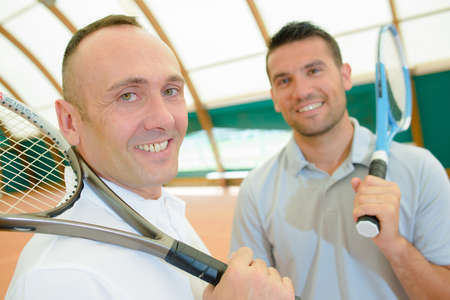 two tennis players having a quick time breakの写真素材