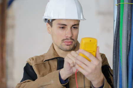 electrician testing the energy of the powerの写真素材