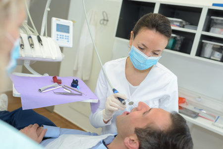 A female dentist with a patient