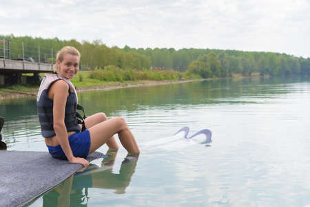 female wakeboarder waiting to start seanceの写真素材