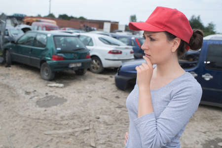 feamle worker on junkyardの写真素材