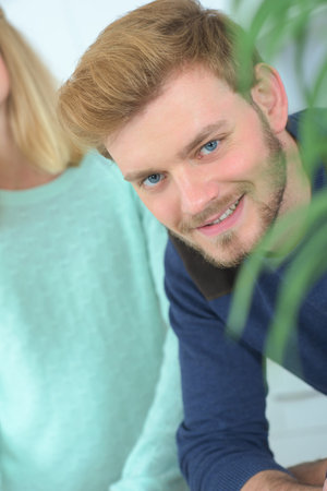 handsome patient in doctors waiting roomの写真素材