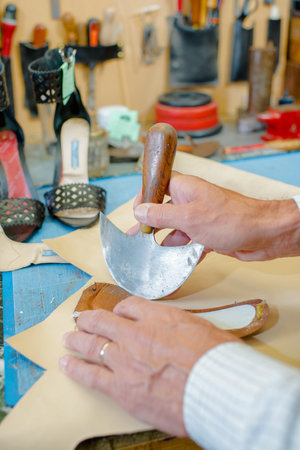 cobbler fixing soles