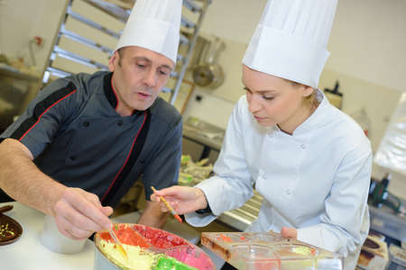 Chefs decorating productの写真素材