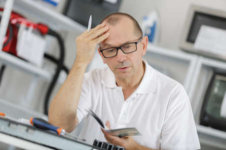 engineer looking in plan of air conditioning systemの写真素材