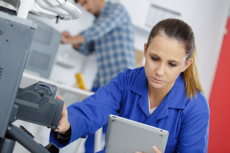 young woman doing a printer maintenance
