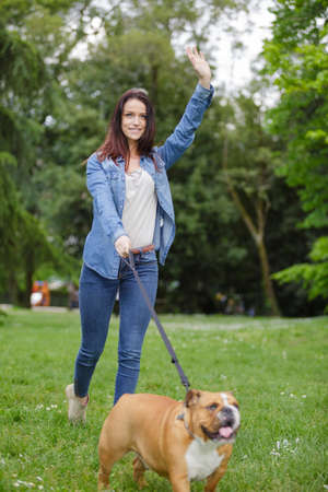 woman with her dog in the parkの写真素材