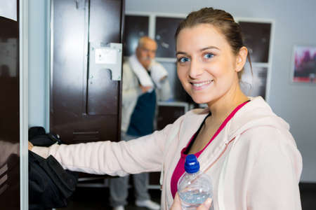 portrait of woman in sportswear at lockerの写真素材