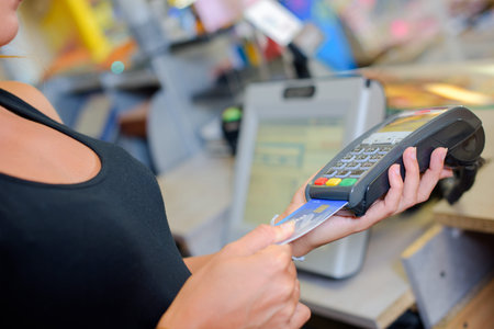 close up of bank terminal with credit car