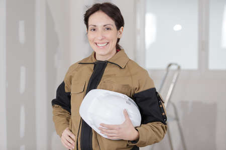 happy female builder on siteの写真素材