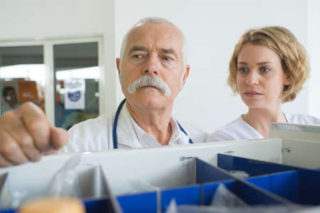 senior male and young female doctors companionsの写真素材