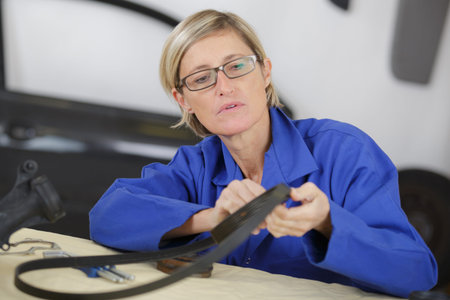 mechanic woman working at car serviceの写真素材