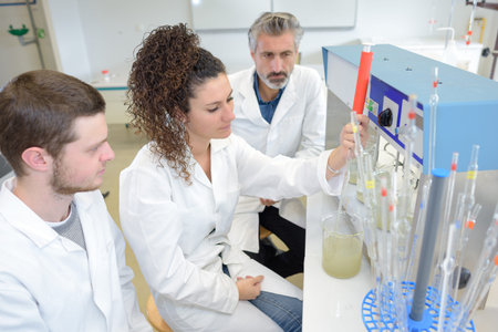 engineering students using an innovative 3d printer in the laboratory