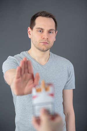 man refuse a cigarettesの写真素材