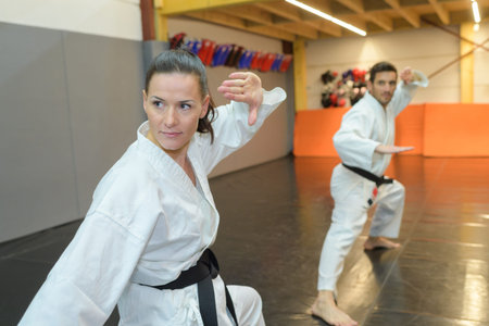 young woman and man karateka trainingの写真素材