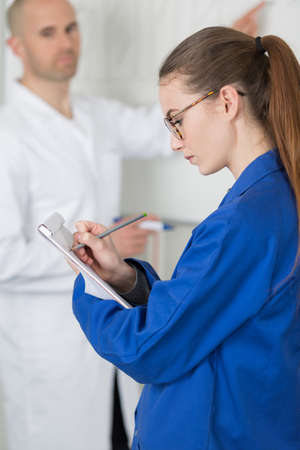 Student writing notesの写真素材