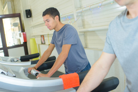 man using a treadmill machine