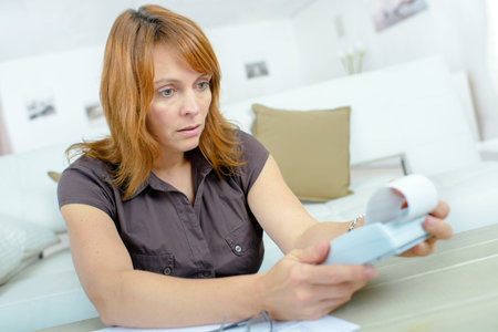 depressed woman accounting at home