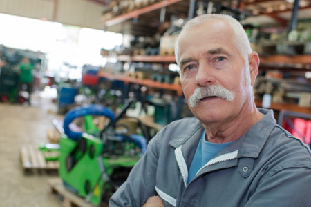 Portrait of senior man in workplace