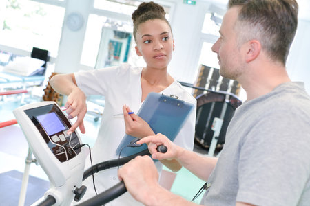 male patient on a testing machine for checking his knee