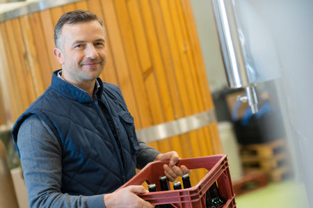 manufacture carrying beer bottles at brweery
