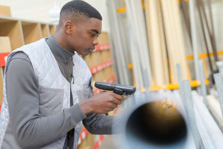 worker using scanner in the warehouseの写真素材