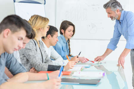 teacher and students in a classroomの写真素材