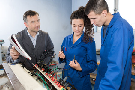 students of training college with electronic components