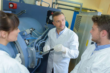 People around pressurised machineryの写真素材