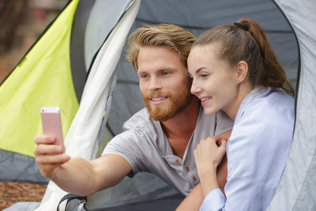 group friends doing a selfie in a camping