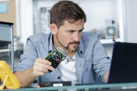 man working in a computer store