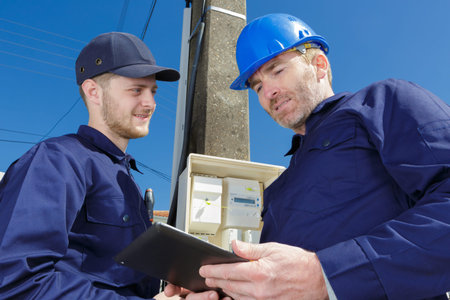 electricians safety inspections of an electrical fusebox