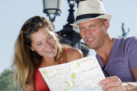 young tourists reading a map
